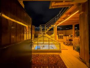 a house with a terrace with a glass box on it at RIAD AMR in Tangier