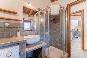 a bathroom with a sink and a shower at EasyHome Malpensa Milano - self-check-in in Somma Lombardo +36 photos