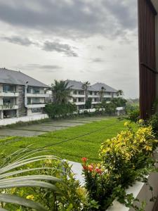 a view from the balcony of a resort at Twin House Villa in Canggu