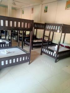 a group of bunk beds in a room at Dormitory Hostel Cam Uo in Nongkhiaw