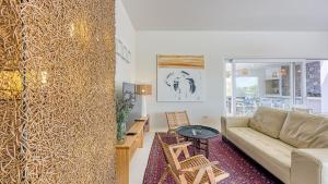 a living room with a couch and a table at Villa Menta 4 by Villas Guide in Malinska