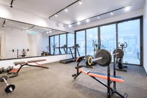 a gym with several different kinds of equipment in a room at Prestige 504 2 BED in Paphos