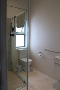 a bathroom with a toilet and a window at Sarah's Place -Stilbaai in Stilbaai +30 photos