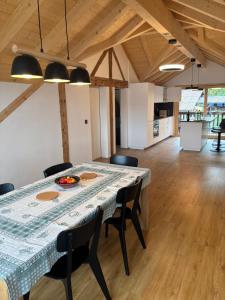 a large dining room with a table and chairs at Apartment Bärgli in Krattigen in Krattigen