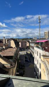 a view of a city with buildings and a street at Stylish Duplex Apartment in Morges
