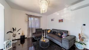 a living room with a couch and a tv at Villa Franka by Villas Guide in Vela Luka