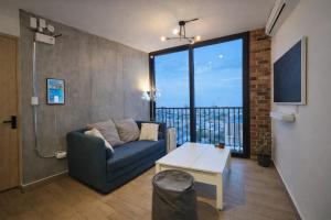 a living room with a couch and a table at BarrioW Apartment 1 Room, parking, pool and view in Monterrey