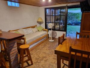 a living room with a couch and a table at Los Nietos in La Paloma