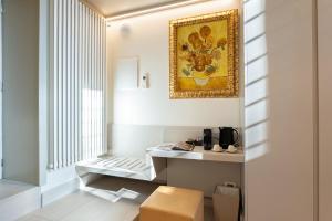 a room with a table and a painting on the wall at Gonfalone 6 in Rome +243 photos