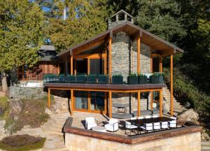 a house with a group of chairs on top of it at Chuckanut Point Villa 2 Bedroom in Bellingham