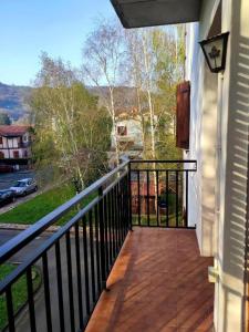 a balcony of a house with a view of a street at APARTAMETO BAZTANGOA I Centro Elizondo in Elizondo
