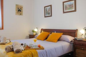 a bedroom with two beds with a tray of food on it at APARTAMETO BAZTANGOA I Centro Elizondo in Elizondo