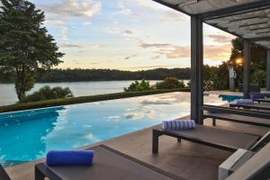 a swimming pool with a view of the water at Bocas del Mar in Boca Chica