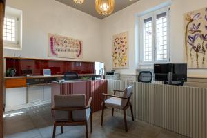 a waiting room with two chairs and a counter at Gonfalone 6 in Rome
