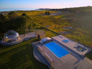 an overhead view of a swimming pool and a domed house at Longbeach Life in Falkenberg