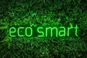 a green sign that says go smart on a hedge at Eco Smart Apartments Erlangen in Erlangen