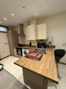 a kitchen with a sink and a counter top at Sunderland City Cozy Flat in Sunderland