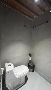 a bathroom with a white toilet in a room at Seet Room in Bilād Sayt +1 photo