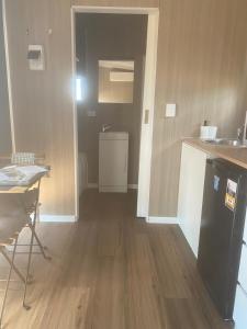 a kitchen with a sink and a counter top at Plain Bush by Tiny Away in Bohena Creek