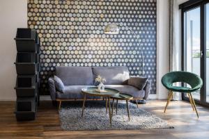a living room with a couch and a table at Eco Smart Apartments Erlangen in Erlangen