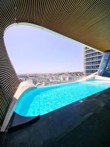 a swimming pool on the top of a building at Urban Heights - Apartment in St Julian's in St. Julianʼs