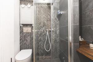 a bathroom with a shower with a toilet at Collazzi 15 in Montepulciano +11 photos