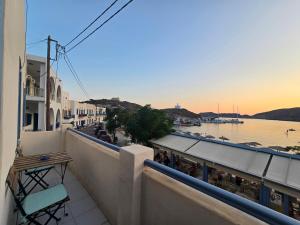 a balcony with a view of a body of water at Kapsali Beach House in Kapsali