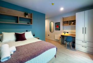 a bedroom with a bed and a desk in it at Queen Street Place in Galway +31 photos