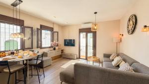 a living room with a couch and a table at Las Huertas 12 in Frigiliana