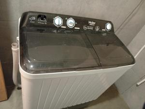 a close up of a toaster oven in a kitchen at Private & Cozy 2 & 3 Bedroom Full Apartment for Families, Couples & Solo Near Islamabad Airport in Islamabad +10 photos