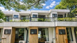 an exterior view of a house with a balcony at Minami Hakone Villa in Kannami