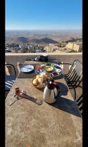 a table with food and a tea kettle on it at Sıla Konağı Hotel in Mardin +63 photos