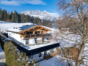 an aerial view of a house in the snow at Haus Hüttenberger in Going am Wilden Kaiser