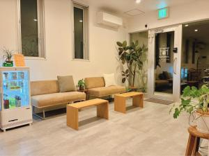 a living room with two couches and two tables at THY GUEST HOUSE in Ise +22 photos