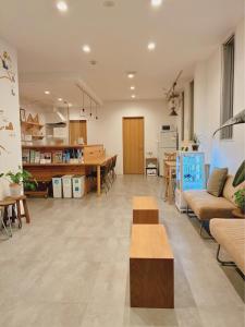 a large living room with couches and a dining room at THY GUEST HOUSE in Ise