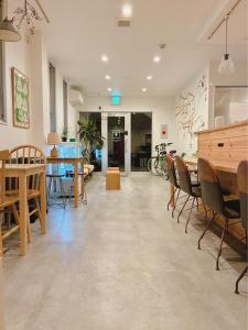 a dining room with tables and chairs in a room at THY GUEST HOUSE in Ise