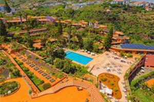 an aerial view of a resort with a swimming pool at Quinta Splendida Wellness & Botanical Garden in Caniço +71 photos