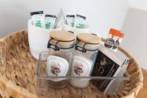 a basket with bottles of vinegar and other products at Edenmore Cottage Bed & Breakfast in Moorefield +46 photos