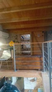 a room with a table and a shelf with wine bottles at La Casita de Lledó in Vilafamés +43 photos