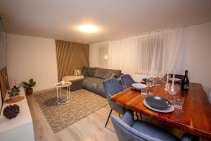 a living room with a table and a couch at Mimi's Home in Dußlingen