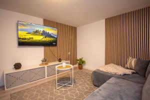 a living room with a couch and a table at Mimi's Home in Dußlingen
