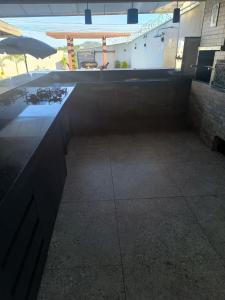 a large room with a pool in a building at Espaço de eventos dorneles in Senador Canedo