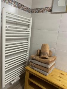 a pile of towels sitting on a table in a bathroom at Umundumhütte in Katsch an der Mur +40 photos