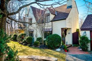 a white house with a tree and a yard at Highland Ave in Norwalk