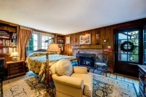 a bedroom with a bed and a fireplace at Highland Ave in Norwalk