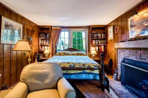 a bedroom with a bed and a fireplace at Highland Ave in Norwalk +22 photos