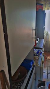 a kitchen with a stove top oven in a kitchen at Tetelos house in Cullinan