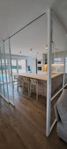 a kitchen and dining room with a table and chairs at EBEIA Casas Rurales IBEAS DE JUARROS (BURGOS) in Ibeas de Juarros