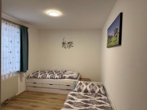 a small bedroom with a bed and a window at Ferienhaus am Bauernhof mit Terrasse nähe Wexl Arena in Sankt Corona am Wechsel