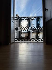 an open door to a balcony with a bird on it at Casa Clara in Castelo de Vide +8 photos
